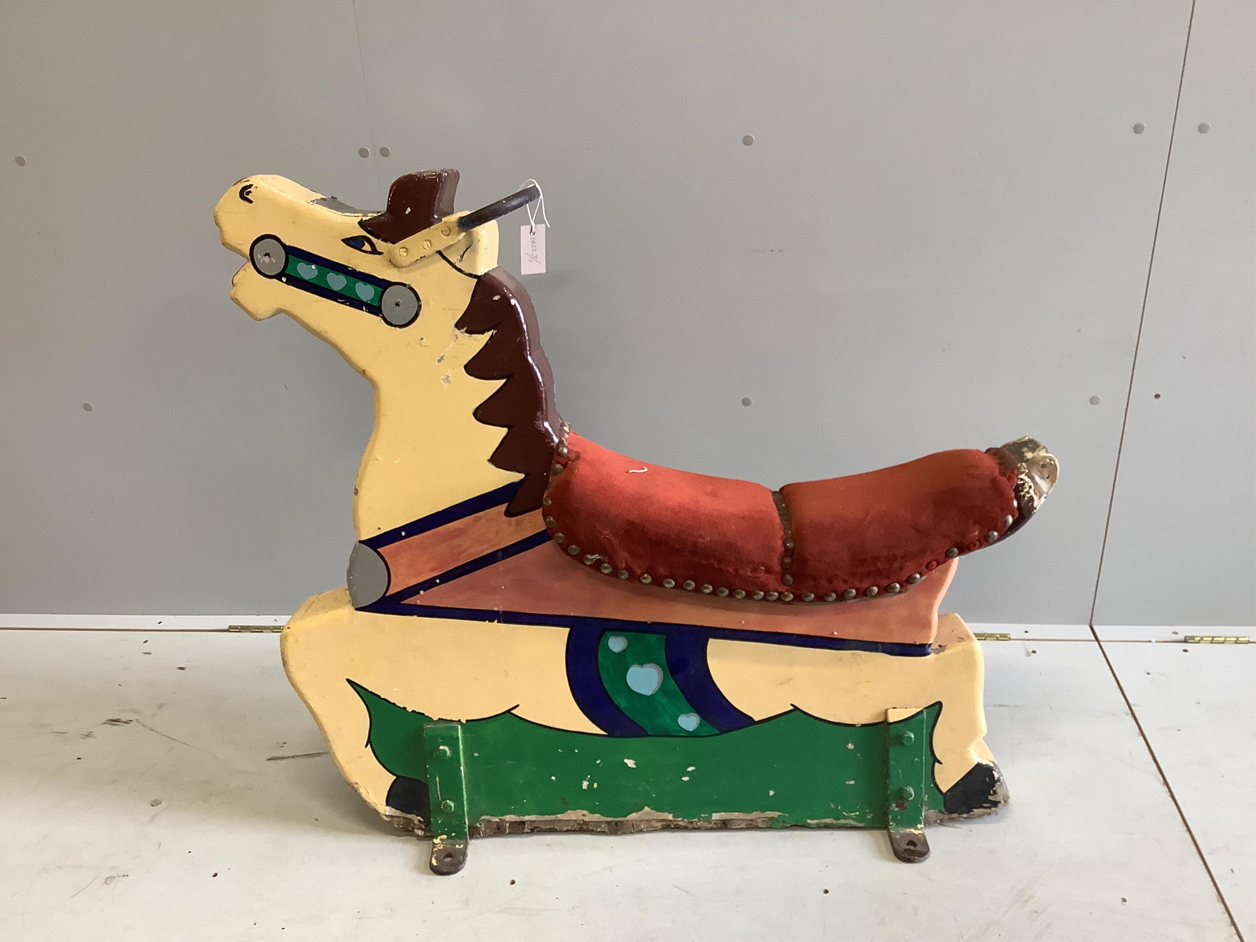 A mid 20th century carved painted wood fairground carousel horse, length 110cm, height 98cm. Condition - fair
